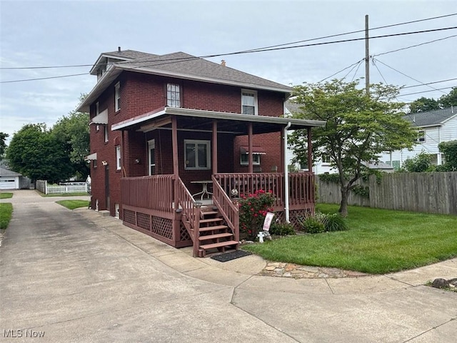 1051 Oakwood Ave NE, Massillon, OH 44646 - american foursquare style home with brick siding and covered porch