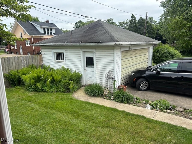 1051 Oakwood Ave NE, Massillon, OH 44646 - view of home's exterior featuring an outbuilding and a garage