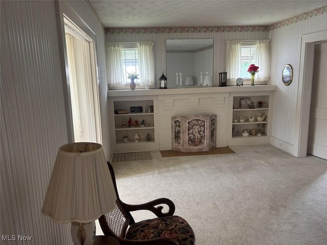 1051 Oakwood Ave NE, Massillon, OH 44646 - living room with wallpapered walls and carpet flooring