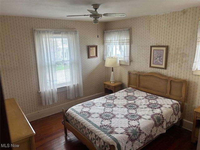 1051 Oakwood Ave NE, Massillon, OH 44646 - bedroom featuring hardwood / wood-style flooring, a ceiling fan, and wallpapered walls