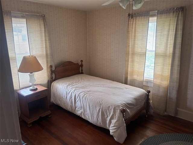 1051 Oakwood Ave NE, Massillon, OH 44646 - bedroom with wood finished floors and multiple windows