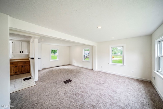6136 Lake Rd W, Ashtabula, OH 44004 - unfurnished living room featuring light colored carpet and recessed lighting