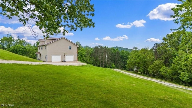 1448 Locust Ridge Rd, Washington, WV 26181 - view of side of home with a garage and a yard