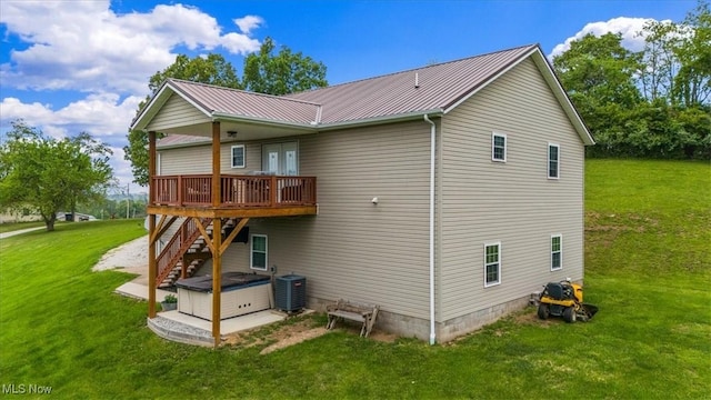 1448 Locust Ridge Rd, Washington, WV 26181 - rear view of property with a wooden deck, stairway, a yard, and a metal roof