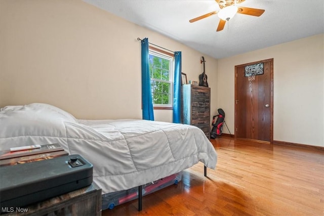 1448 Locust Ridge Rd, Washington, WV 26181 - bedroom with wood finished floors and a ceiling fan