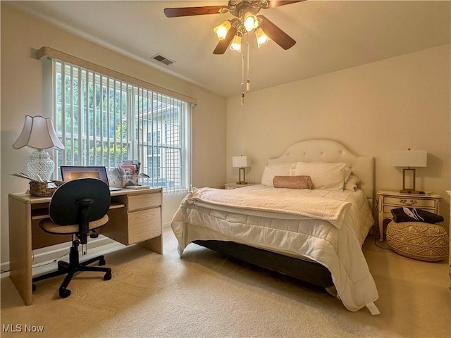 203 Willow Brook Dr NE, Warren, OH 44483 - carpeted bedroom with an office area and a ceiling fan