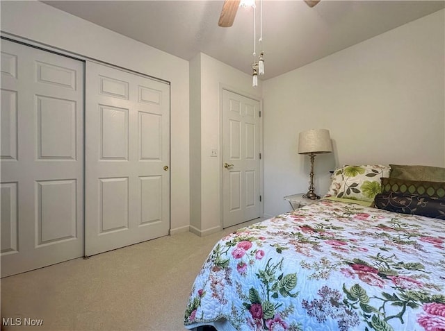 203 Willow Brook Dr NE, Warren, OH 44483 - bedroom with light colored carpet, ceiling fan, and a closet