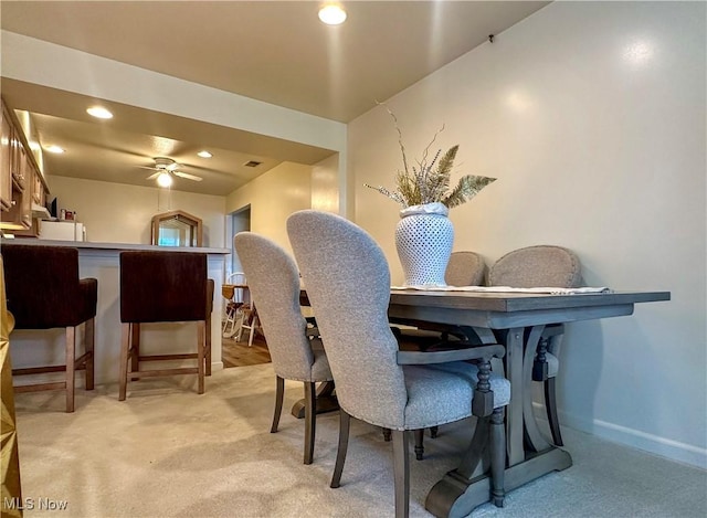 203 Willow Brook Dr NE, Warren, OH 44483 - dining space with light colored carpet, recessed lighting, ceiling fan, and bar