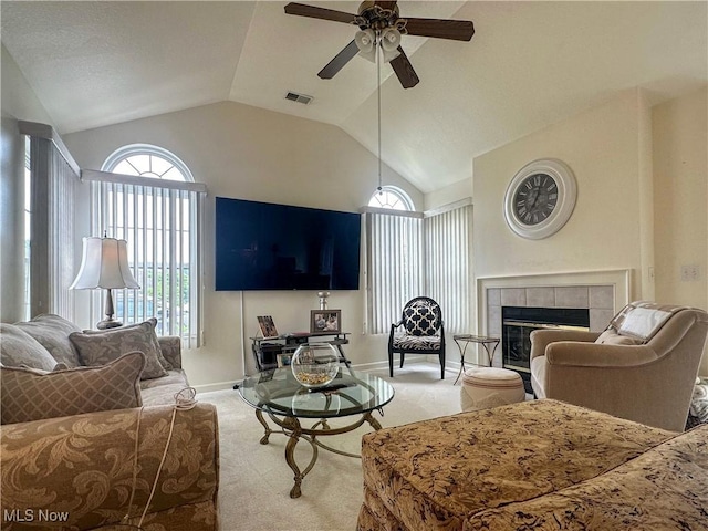 203 Willow Brook Dr NE, Warren, OH 44483 - carpeted living room featuring lofted ceiling, a ceiling fan, and a fireplace