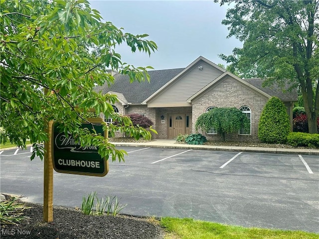 203 Willow Brook Dr NE, Warren, OH 44483 - view of building exterior with uncovered parking