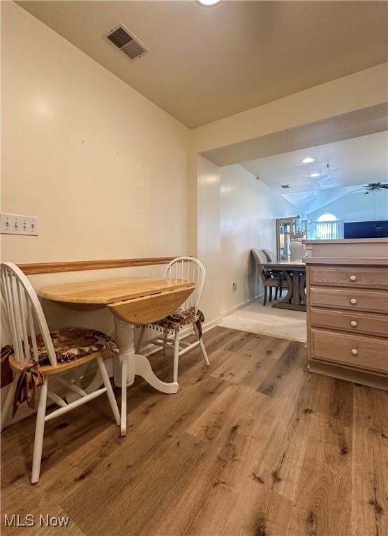 203 Willow Brook Dr NE, Warren, OH 44483 - dining room featuring wood finished floors and lofted ceiling