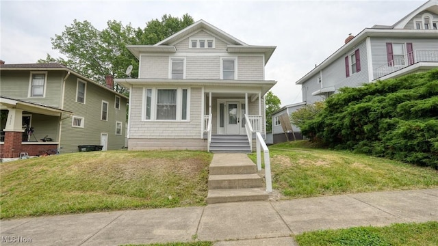 1515 Stewart Ave, Cambridge, OH 43725 - american foursquare style home featuring a front lawn and covered porch