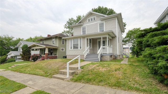 1515 Stewart Ave, Cambridge, OH 43725 - traditional style home featuring a porch and a front lawn
