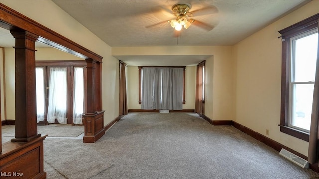 1515 Stewart Ave, Cambridge, OH 43725 - spare room with ornate columns, carpet flooring, and healthy amount of natural light