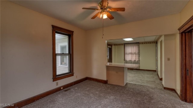 1515 Stewart Ave, Cambridge, OH 43725 - carpeted spare room with baseboards and a ceiling fan