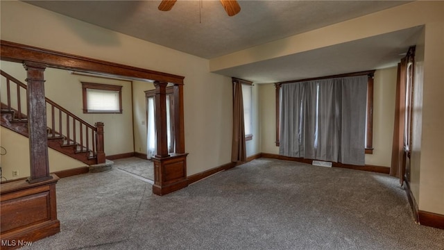 1515 Stewart Ave, Cambridge, OH 43725 - carpeted empty room featuring stairs and ceiling fan