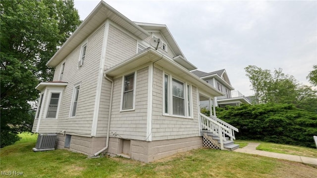 1515 Stewart Ave, Cambridge, OH 43725 - view of home's exterior featuring a central AC unit and a yard