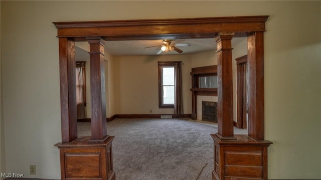 1515 Stewart Ave, Cambridge, OH 43725 - unfurnished living room with carpet, ceiling fan, and a tiled fireplace