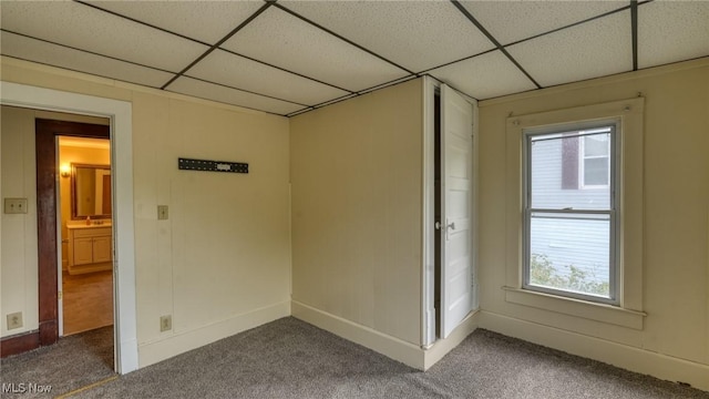 1515 Stewart Ave, Cambridge, OH 43725 - carpeted spare room featuring a paneled ceiling and plenty of natural light