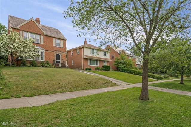 3846 Washington Blvd, University Heights, OH 44118 - view of front facade featuring a front yard and brick siding