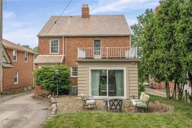 3846 Washington Blvd, University Heights, OH 44118 - back of property featuring a balcony, brick siding, and a chimney