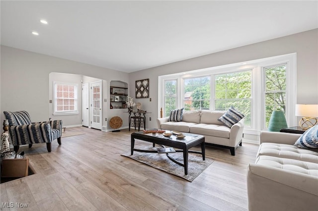 3846 Washington Blvd, University Heights, OH 44118 - living room featuring light wood-style floors, recessed lighting, and arched walkways