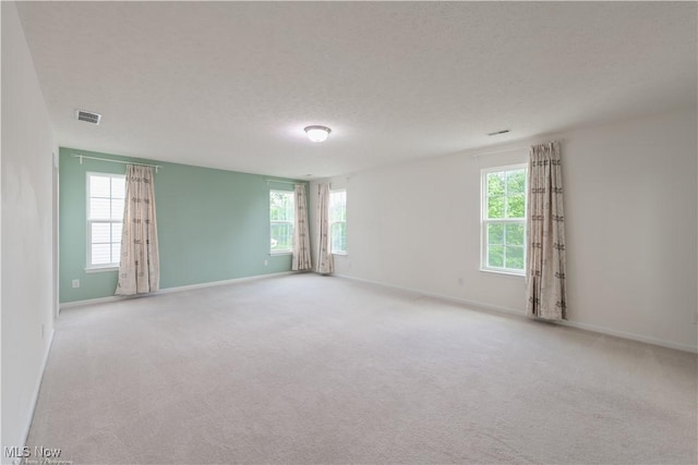 3478 Shadow Ledge Dr, Twinsburg, OH 44087 - spare room featuring plenty of natural light and carpet