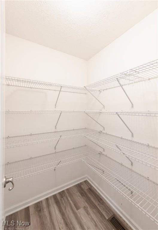 3478 Shadow Ledge Dr, Twinsburg, OH 44087 - walk in closet featuring wood finished floors