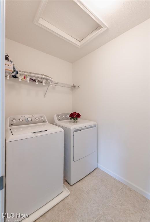 3478 Shadow Ledge Dr, Twinsburg, OH 44087 - washroom with washing machine and clothes dryer and attic access