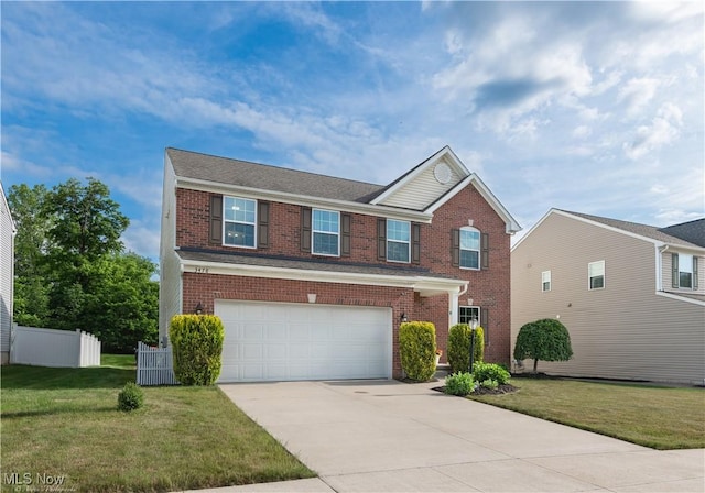 3478 Shadow Ledge Dr, Twinsburg, OH 44087 - traditional-style home featuring brick siding, a garage, and driveway