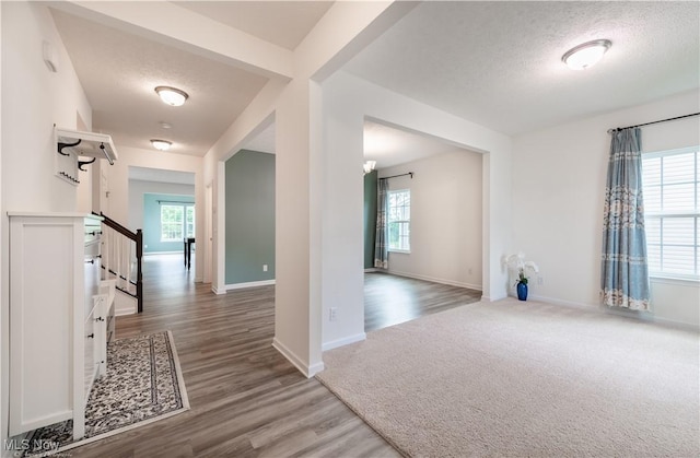 3478 Shadow Ledge Dr, Twinsburg, OH 44087 - entrance foyer featuring plenty of natural light, stairs, wood finished floors, and a textured ceiling