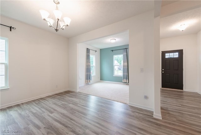3478 Shadow Ledge Dr, Twinsburg, OH 44087 - spare room featuring a chandelier and wood finished floors