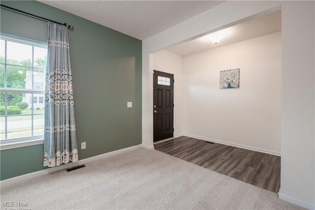 3478 Shadow Ledge Dr, Twinsburg, OH 44087 - foyer entrance with plenty of natural light and dark colored carpet