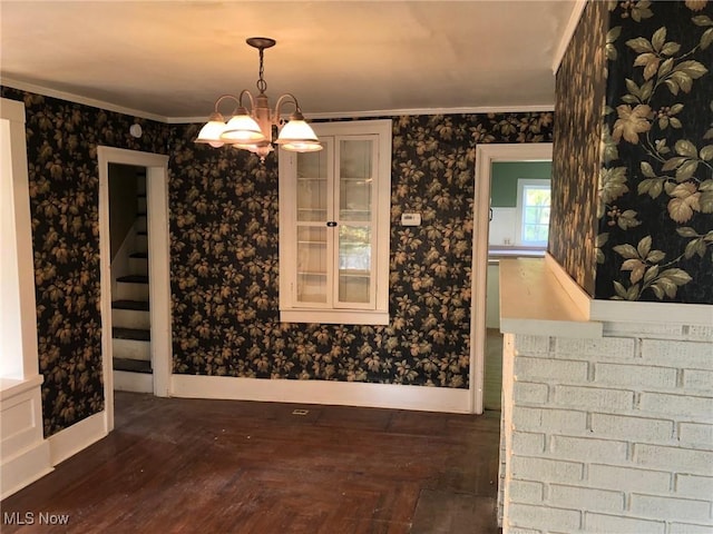 9117 N Main St, Windham, OH 44288 - unfurnished dining area featuring ornamental molding, a chandelier, and parquet flooring