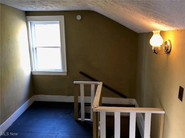 9117 N Main St, Windham, OH 44288 - stairs with a textured ceiling and lofted ceiling