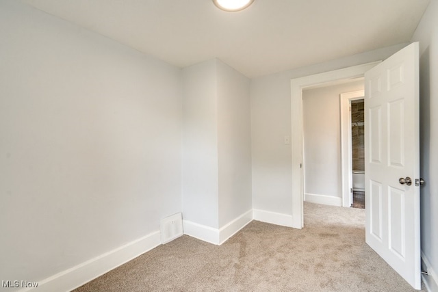 1617 Royal Ave NE, Canton, OH 44705 - spare room with light carpet and baseboards