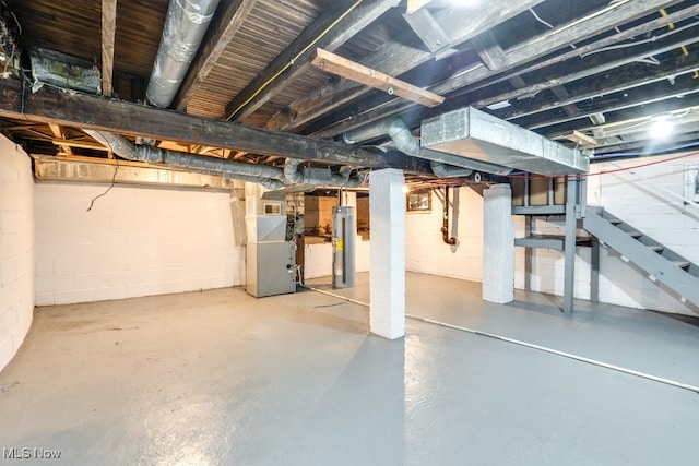 1617 Royal Ave NE, Canton, OH 44705 - unfinished below grade area featuring water heater, stairs, and heating unit