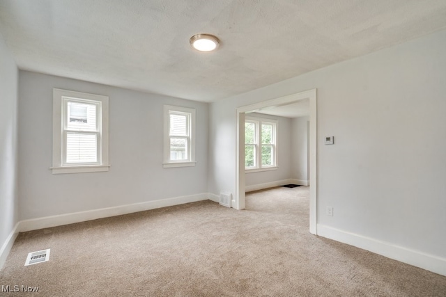 1617 Royal Ave NE, Canton, OH 44705 - carpeted empty room featuring baseboards
