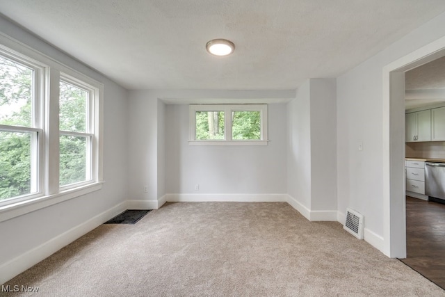 1617 Royal Ave NE, Canton, OH 44705 - carpeted empty room featuring baseboards