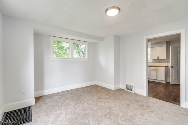 1617 Royal Ave NE, Canton, OH 44705 - spare room featuring carpet flooring and baseboards