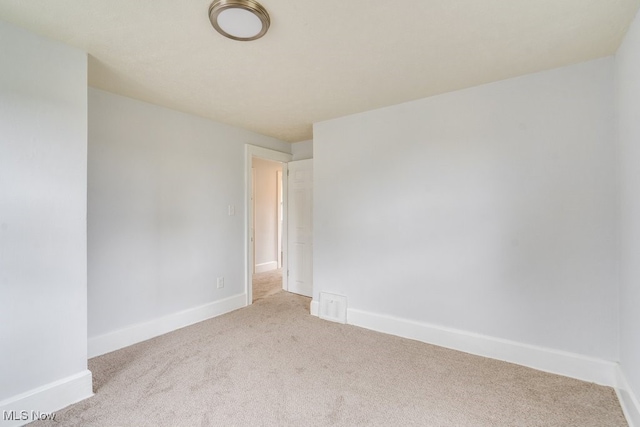 1617 Royal Ave NE, Canton, OH 44705 - carpeted spare room featuring baseboards