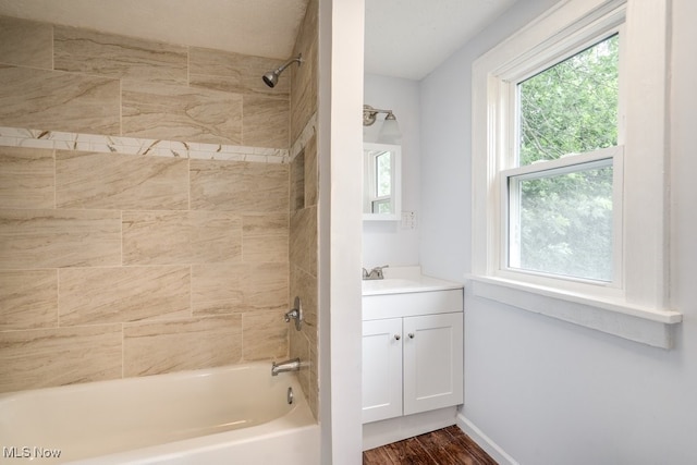 1617 Royal Ave NE, Canton, OH 44705 - bathroom featuring vanity, shower / bath combination, and wood finished floors