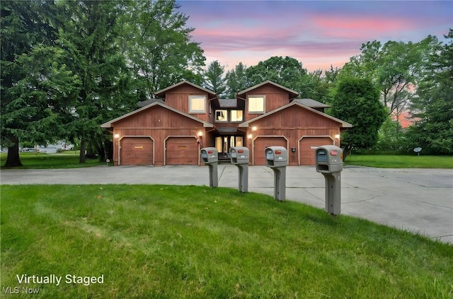 2709 Graham Rd, Stow, OH 44224 - view of front facade with driveway, a lawn, and an attached garage
