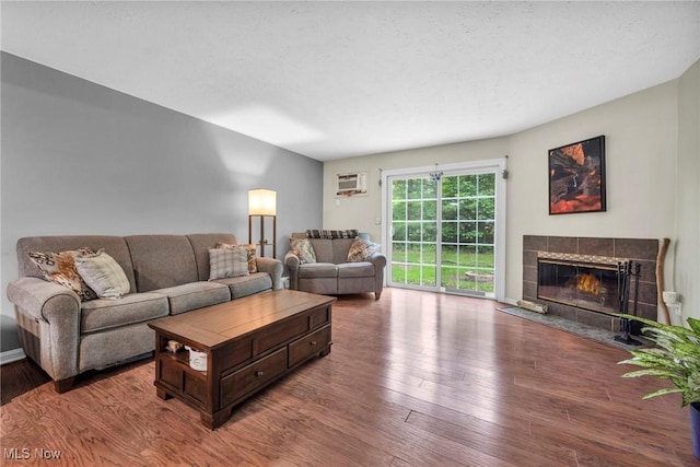 2709 Graham Rd, Stow, OH 44224 - living area with a fireplace, wood finished floors, and a wall mounted AC