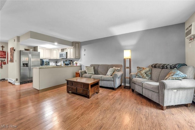 2709 Graham Rd, Stow, OH 44224 - living room featuring light wood-style floors and baseboard heating