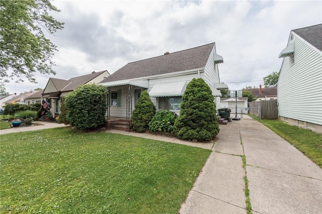 13112 Shady Oak Blvd, Garfield Heights, OH 44125 - view of front of home with driveway and a shingled roof
