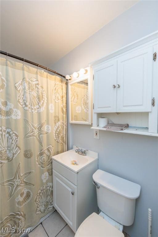 13112 Shady Oak Blvd, Garfield Heights, OH 44125 - bathroom featuring vanity, tile patterned floors, and curtained shower