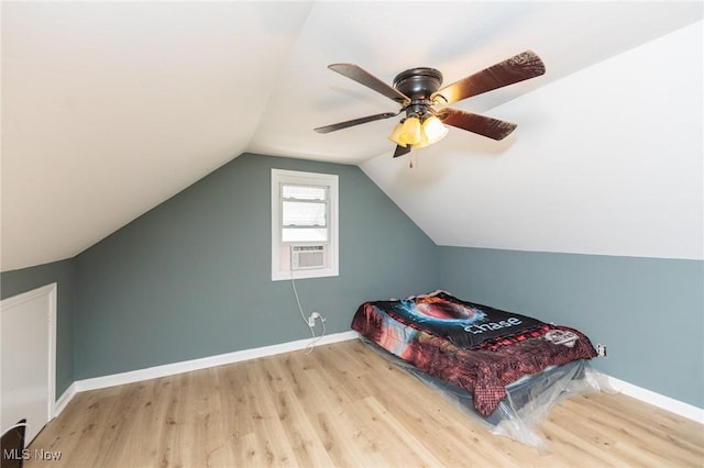 13112 Shady Oak Blvd, Garfield Heights, OH 44125 - bedroom with wood finished floors, ceiling fan, vaulted ceiling, and cooling unit