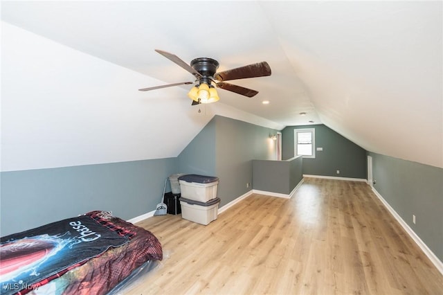 13112 Shady Oak Blvd, Garfield Heights, OH 44125 - bedroom with wood finished floors, vaulted ceiling, and ceiling fan