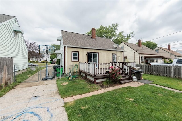 13112 Shady Oak Blvd, Garfield Heights, OH 44125 - view of front of home with a gate, a wooden deck, a shingled roof, and a chimney